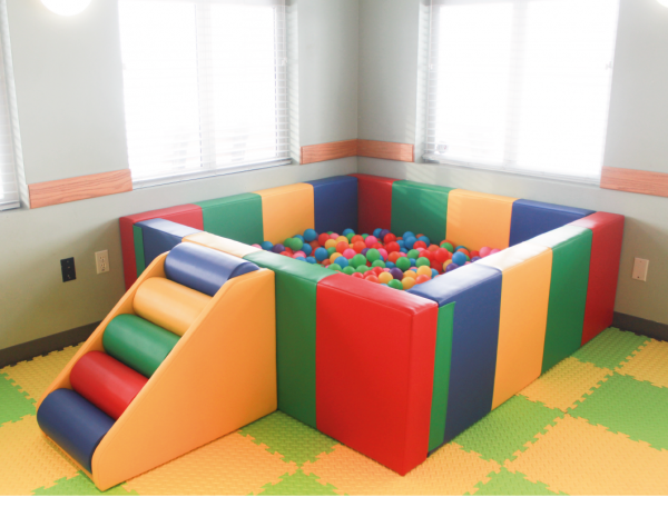 colourful ball pit. square. multi coloured step up. filled with multi colour balls